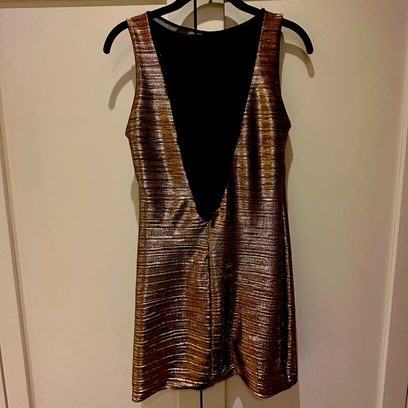 Shiny to tight mini dress with open mesh back Medium but fits XS or S - Picture 2 of 3